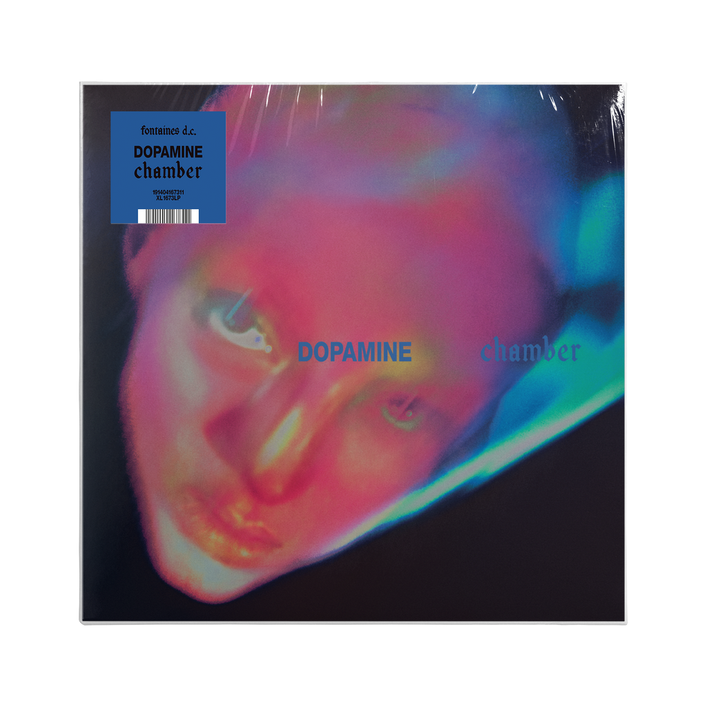 Vinyl record cover for 'Dopamine chamber', featuring a close-up portrait of a neon distorted face on a black background.