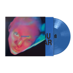 A vinyl record partially pulled from its sleeve, showing a blue disc and matching blue inner sleeve over an album cover with a neon portrait. 