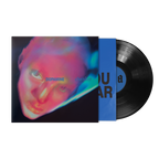 A vinyl record partially pulled from its sleeve, showing a black LP with a blue center label and a colorful album cover.
